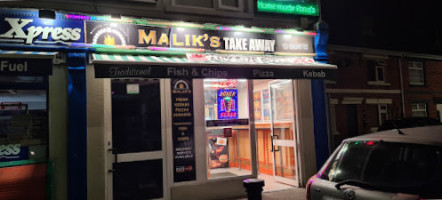 Malik S. Takeaway outside